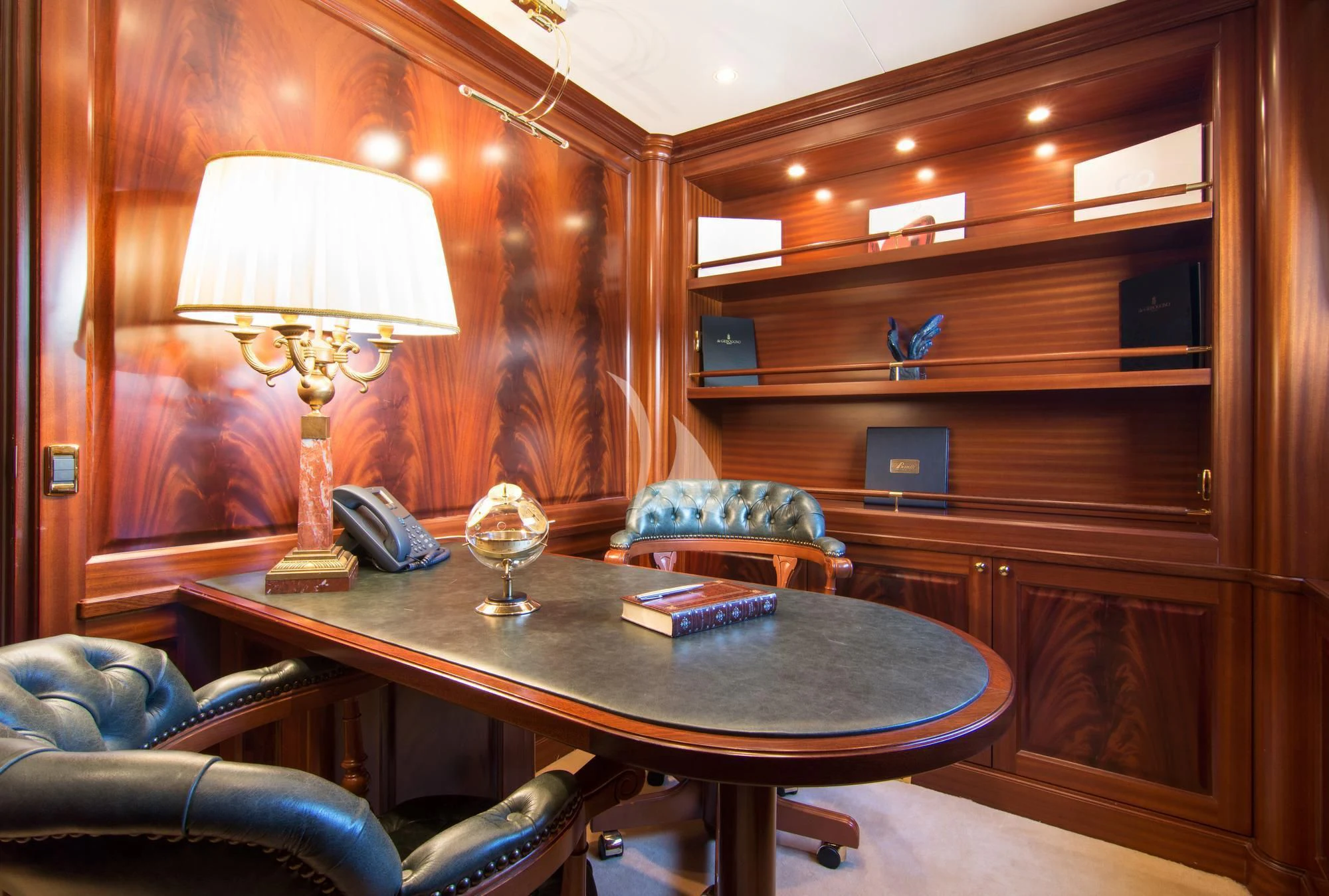 a room with a table and a lamp aboard OPTION B Yacht for Charter