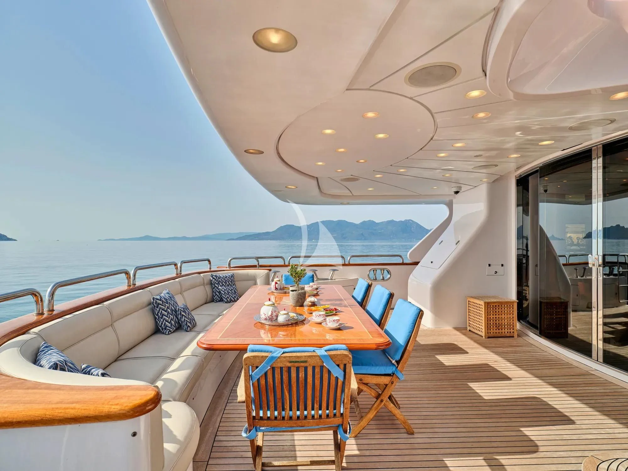 a room with a table and chairs aboard OPTION B Yacht for Charter