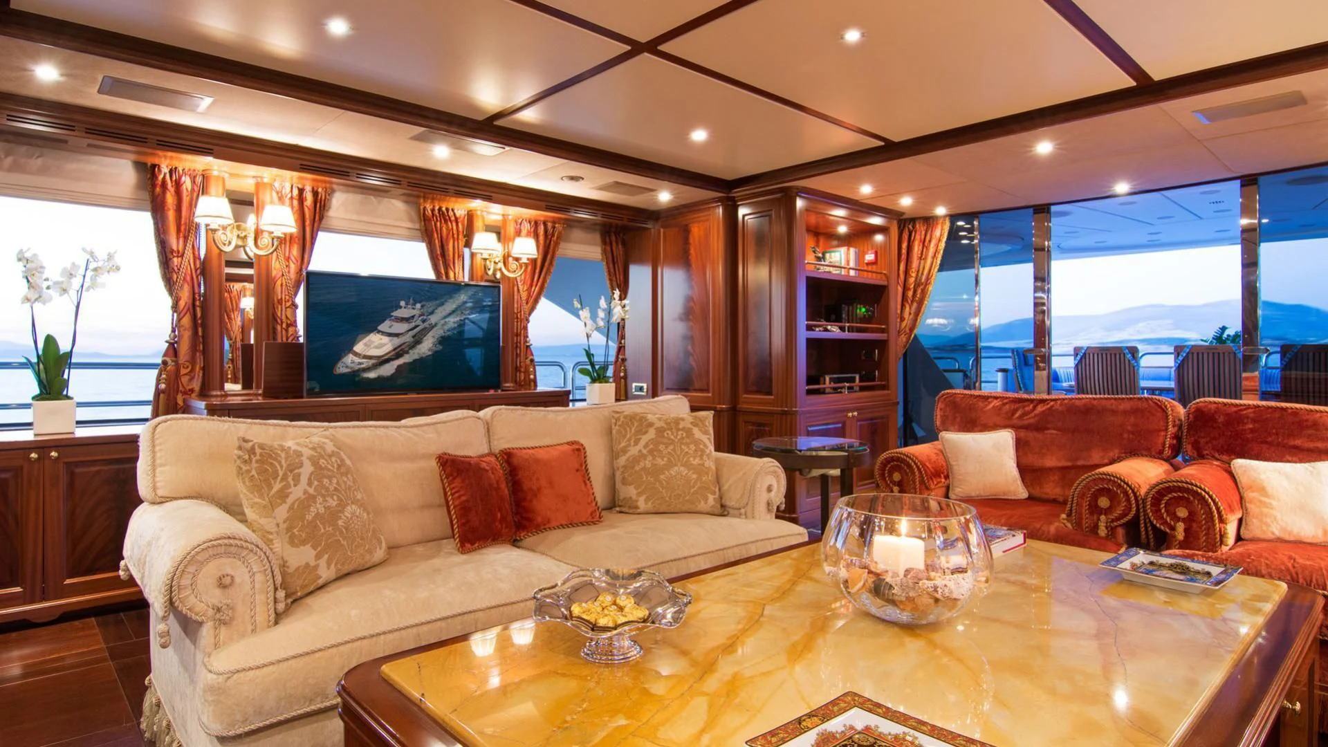 a living room with a large window aboard OPTION B Yacht for Charter