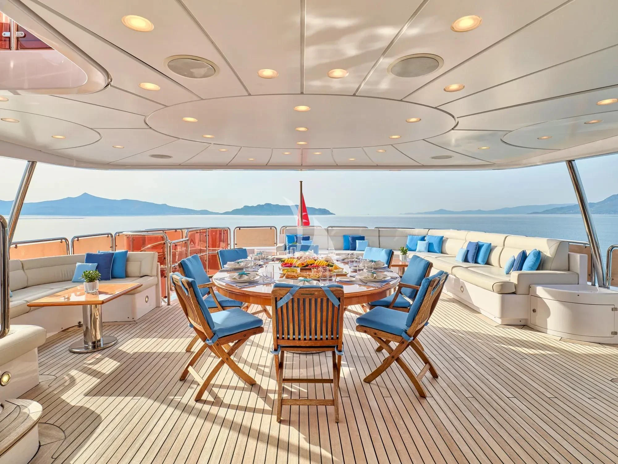 a room with a table and chairs aboard OPTION B Yacht for Charter