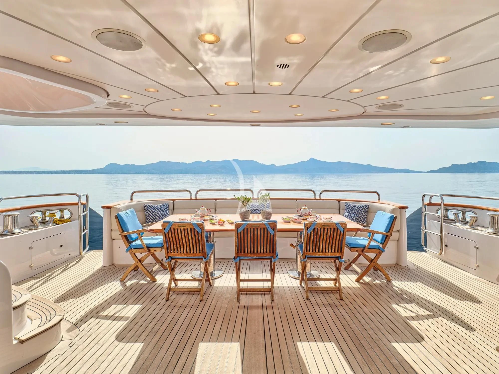 a large kitchen with a table and chairs aboard OPTION B Yacht for Charter