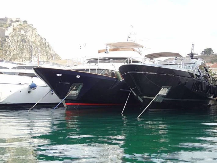 boats docked at a pier aboard OPTION B Yacht for Charter