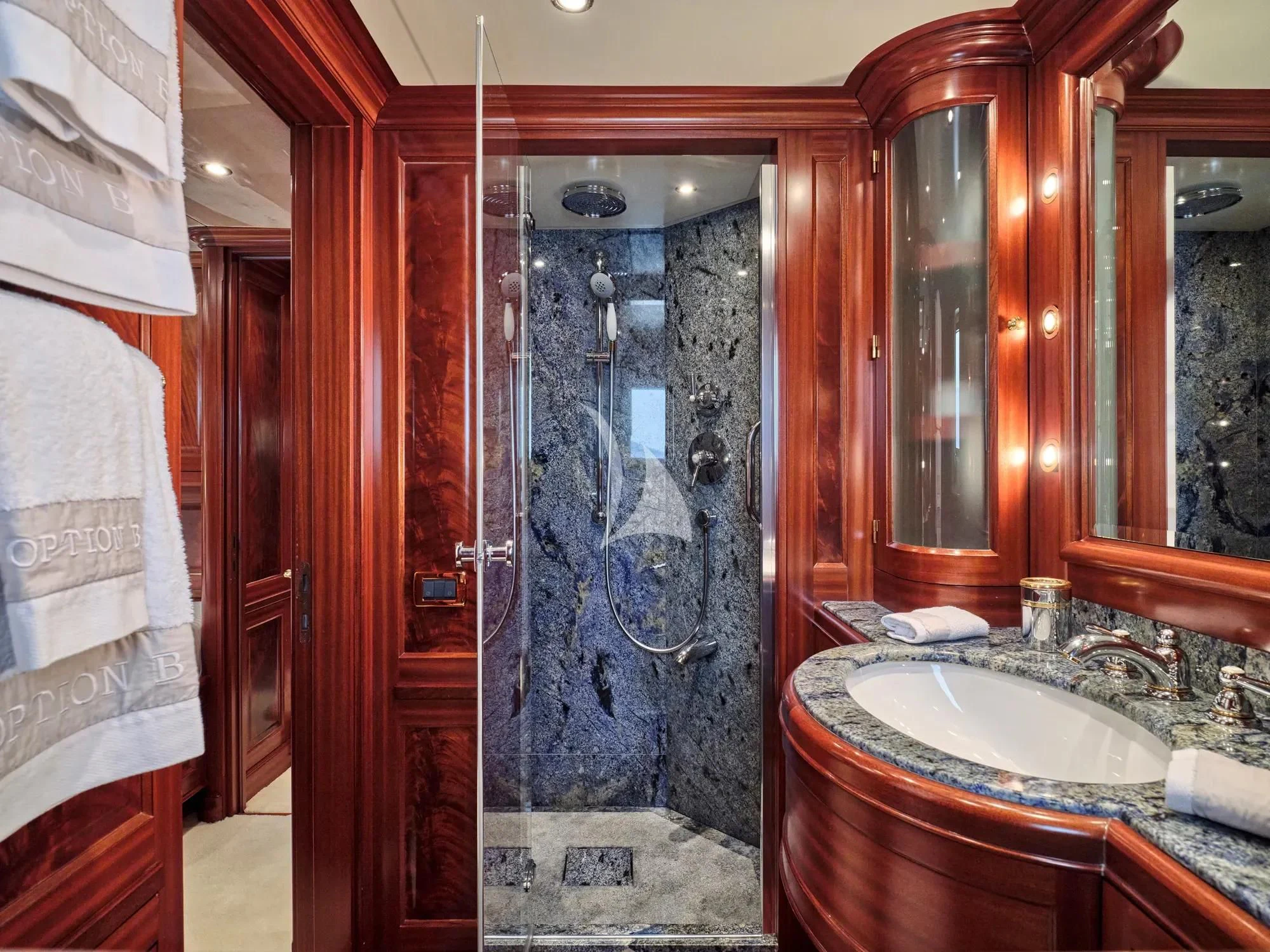 a bathroom with a glass shower aboard OPTION B Yacht for Charter