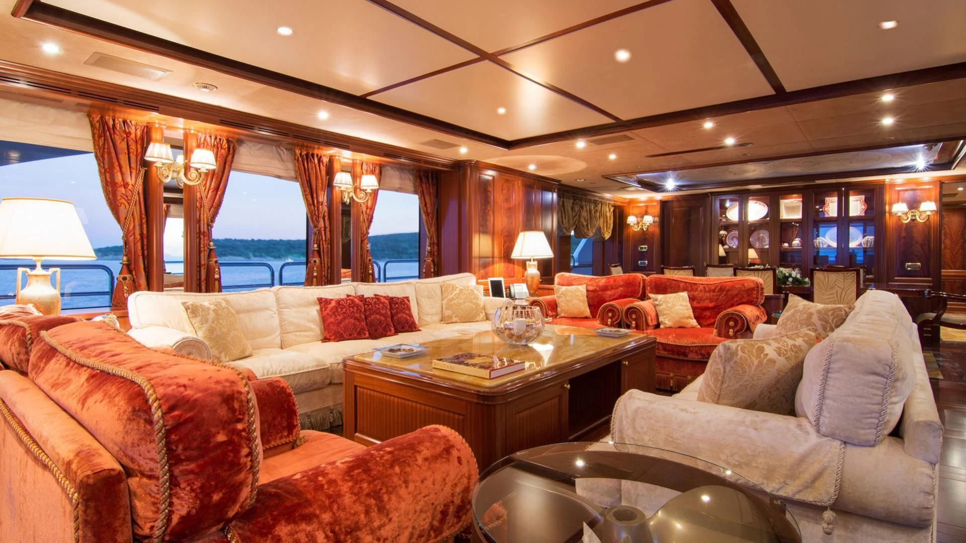 a living room with a large window aboard OPTION B Yacht for Charter