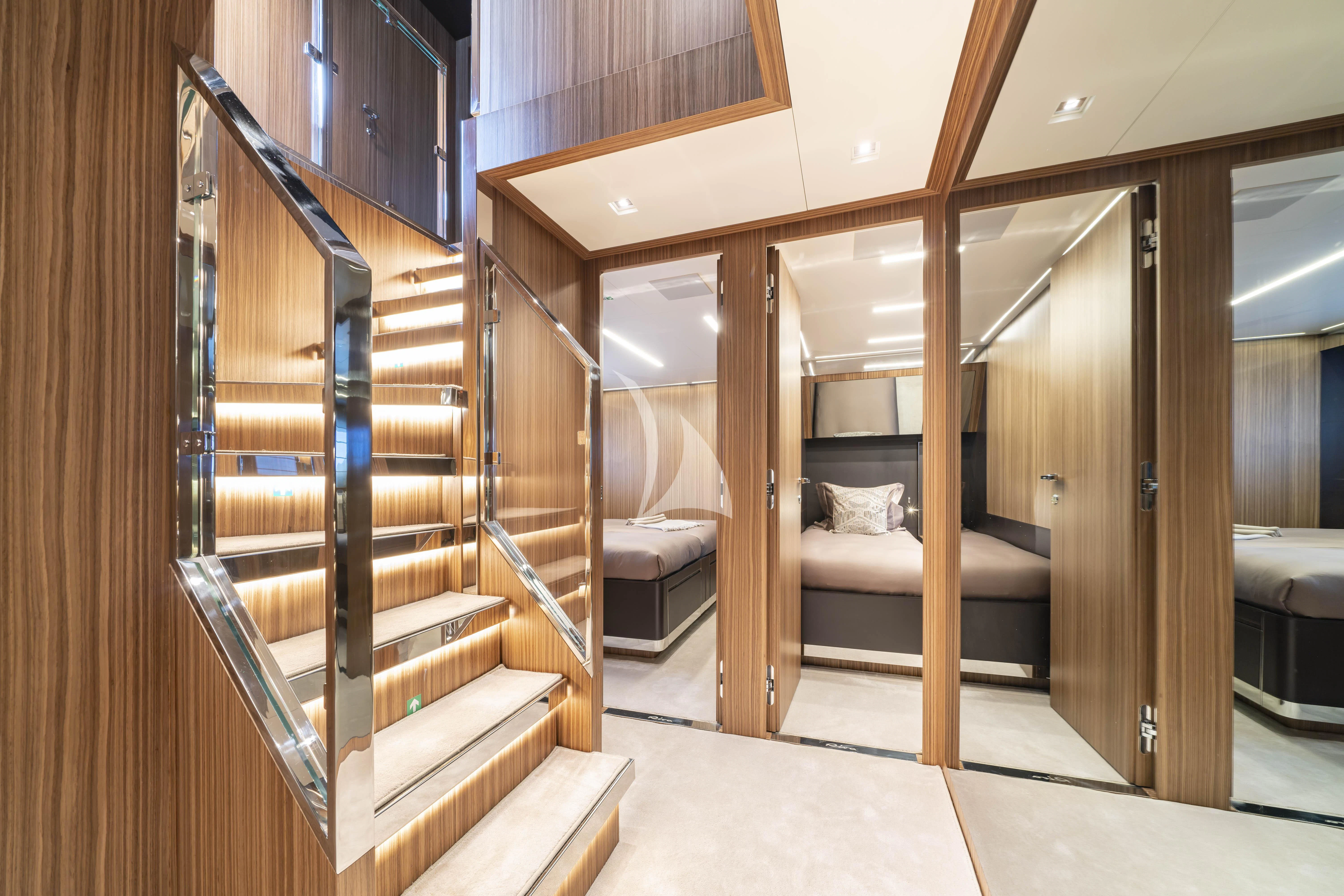 a room with wooden bunk beds aboard HP6 Yacht for Charter