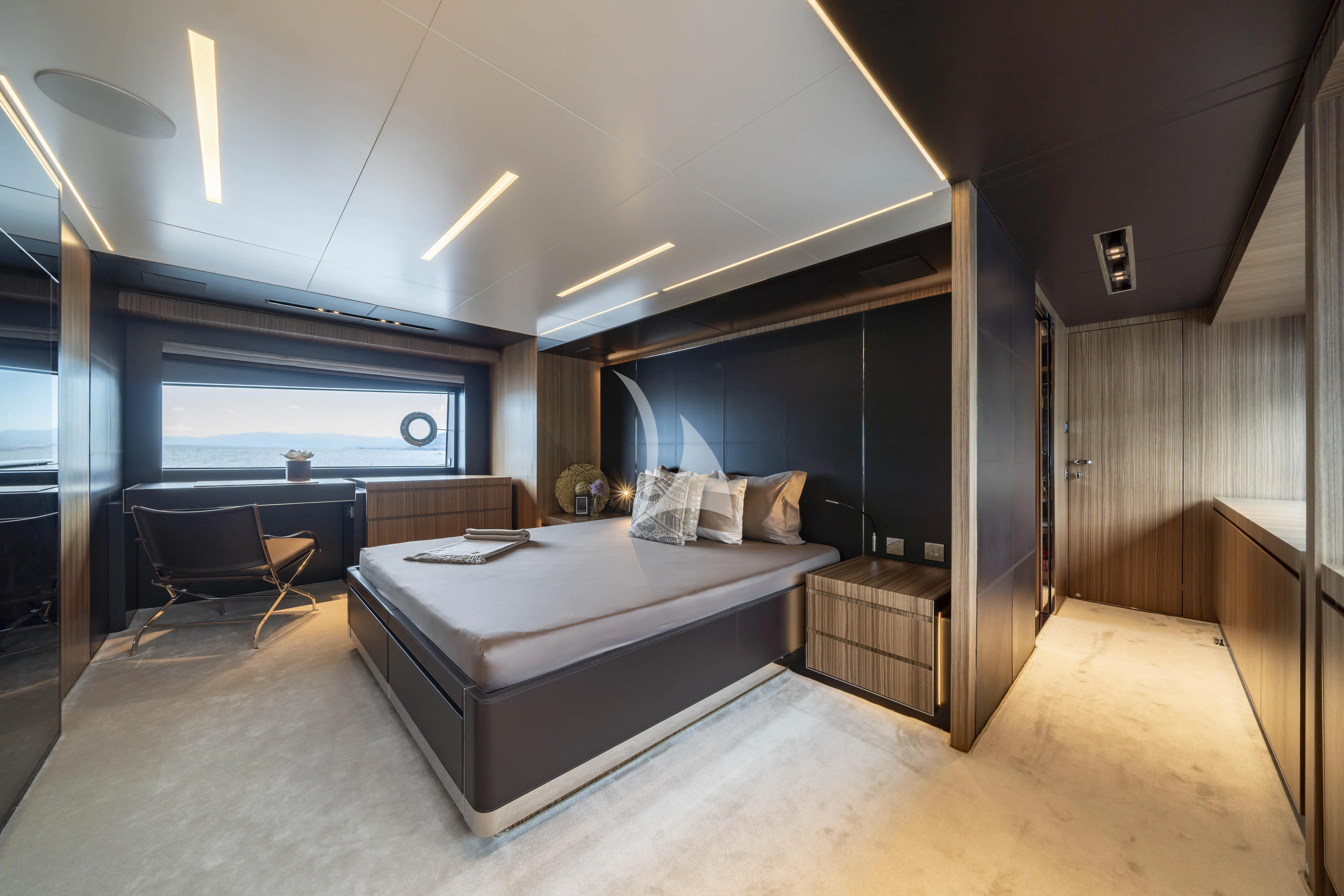 a large bedroom with a large bed aboard HP6 Yacht for Charter