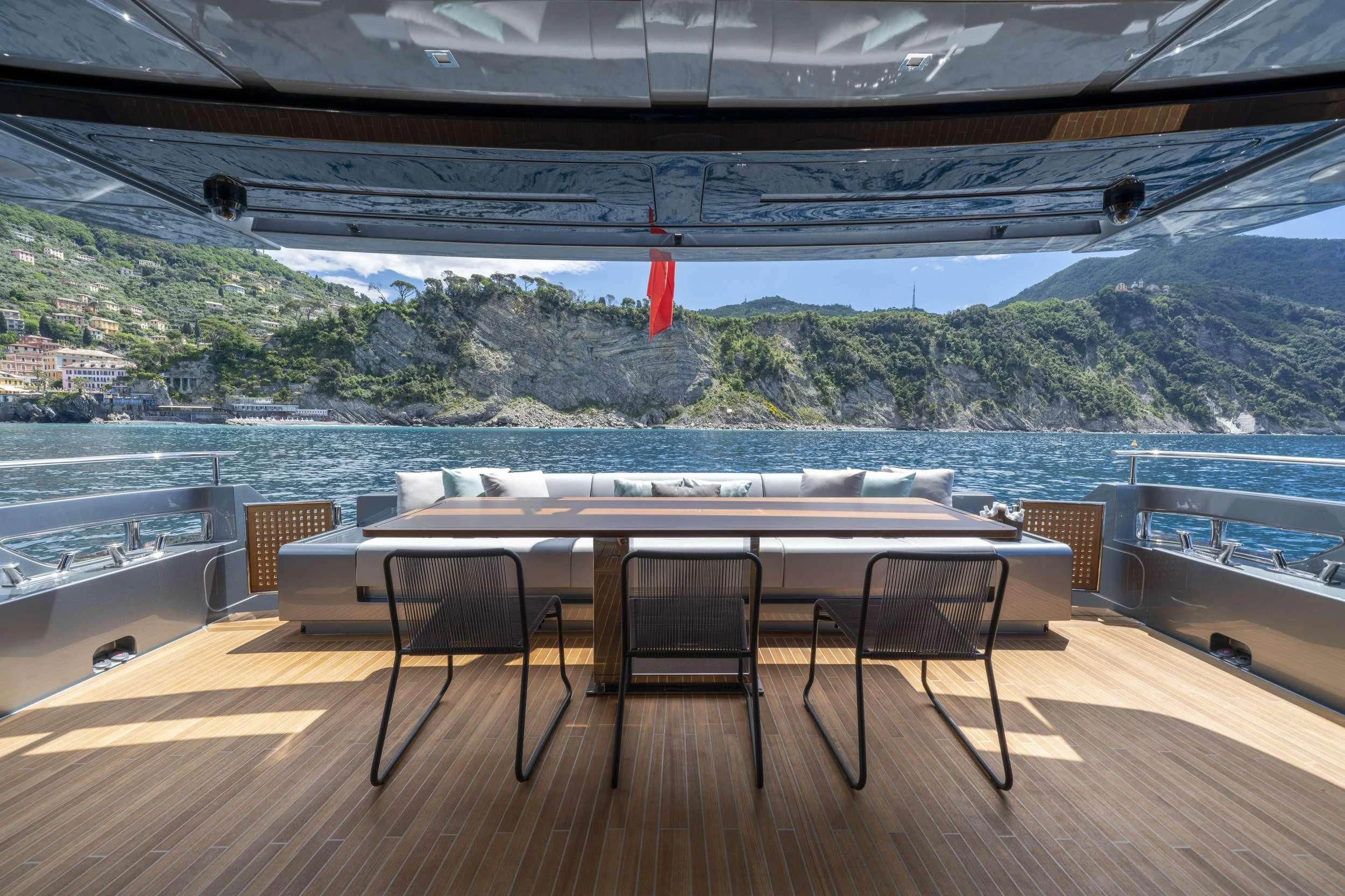 a table and chairs on a deck aboard HP6 Yacht for Charter