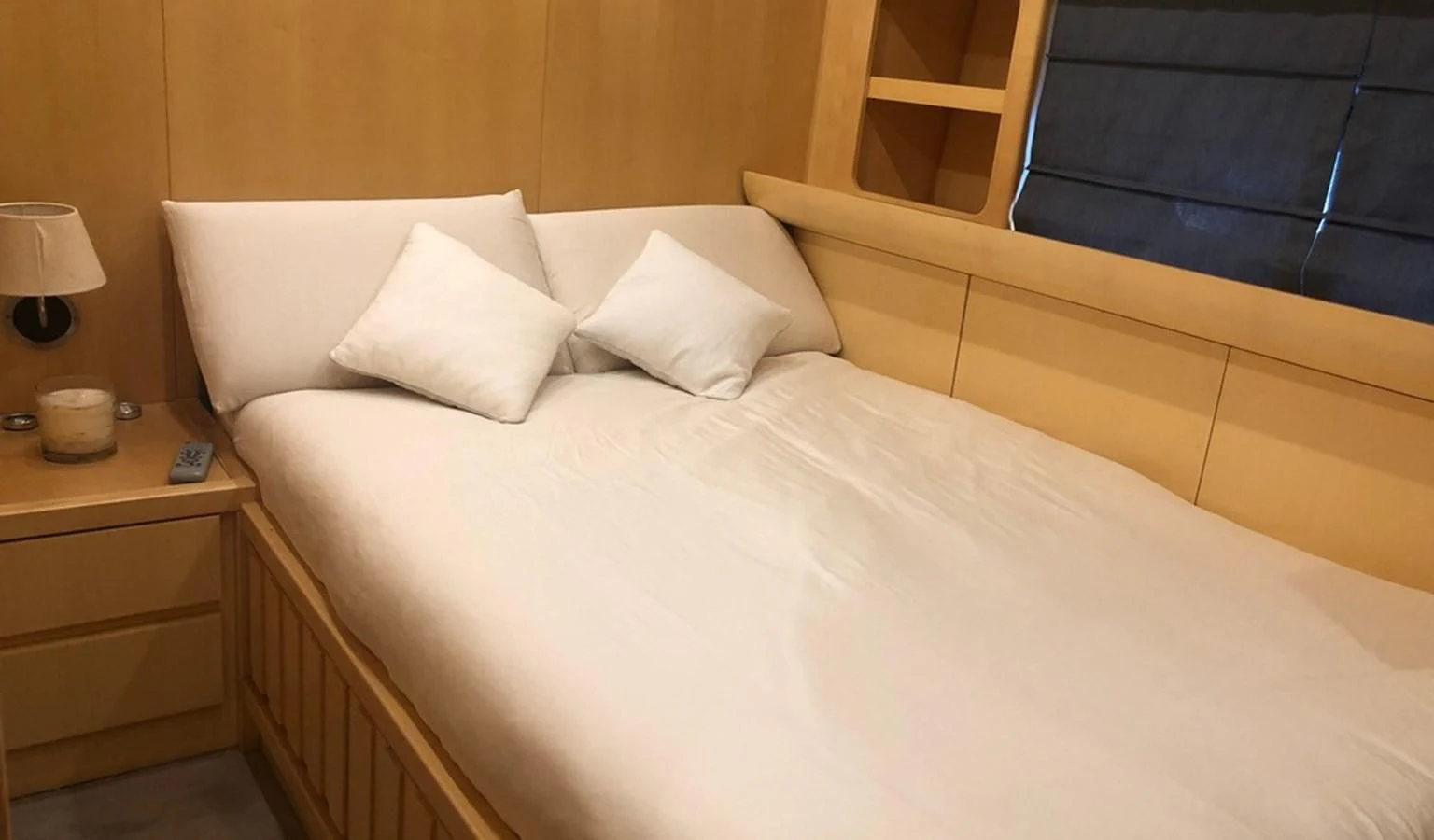 a bed with white sheets aboard AYA Yacht for Sale