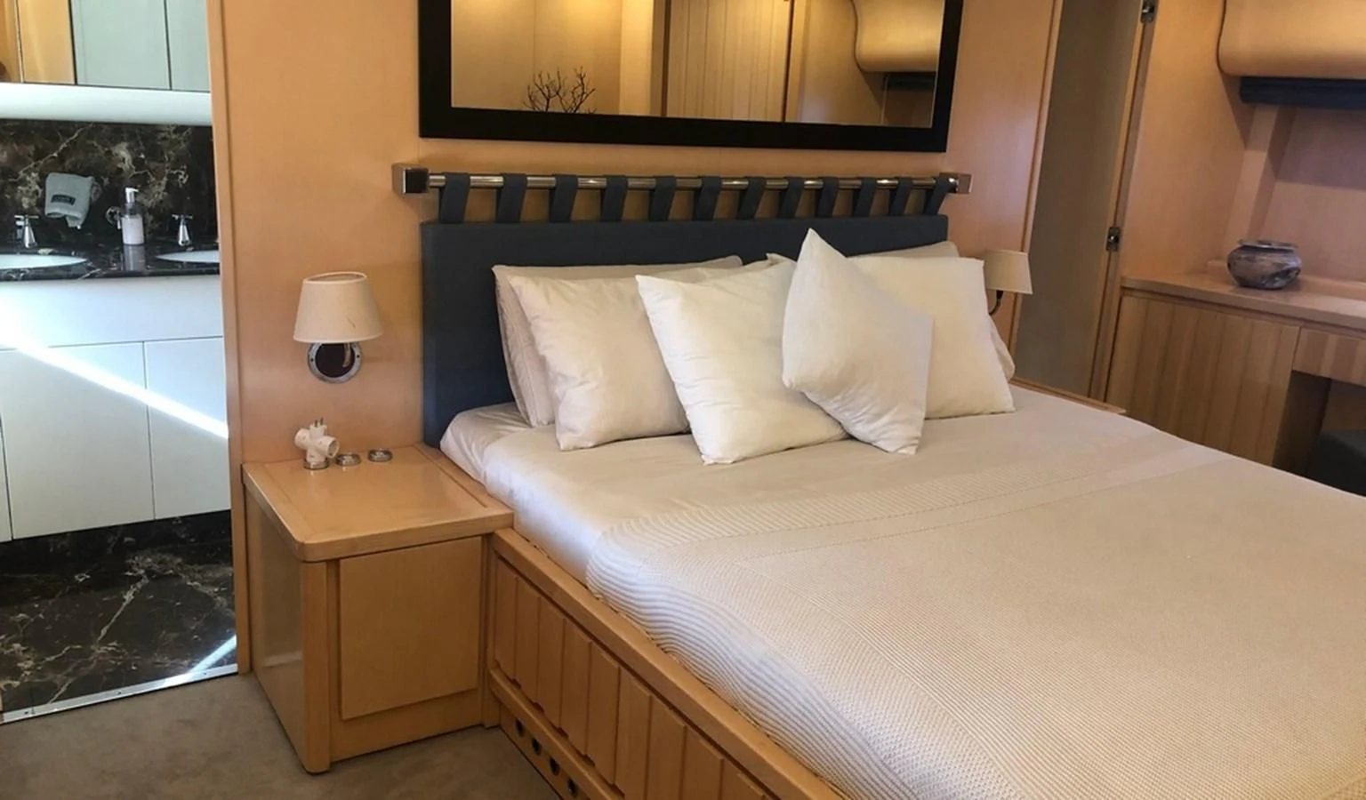 a bed with white sheets aboard AYA Yacht for Sale