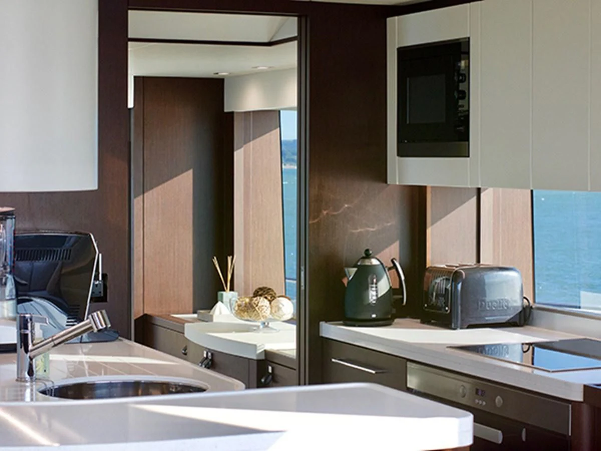 a kitchen with a sink and a microwave aboard LADY O Yacht for Sale