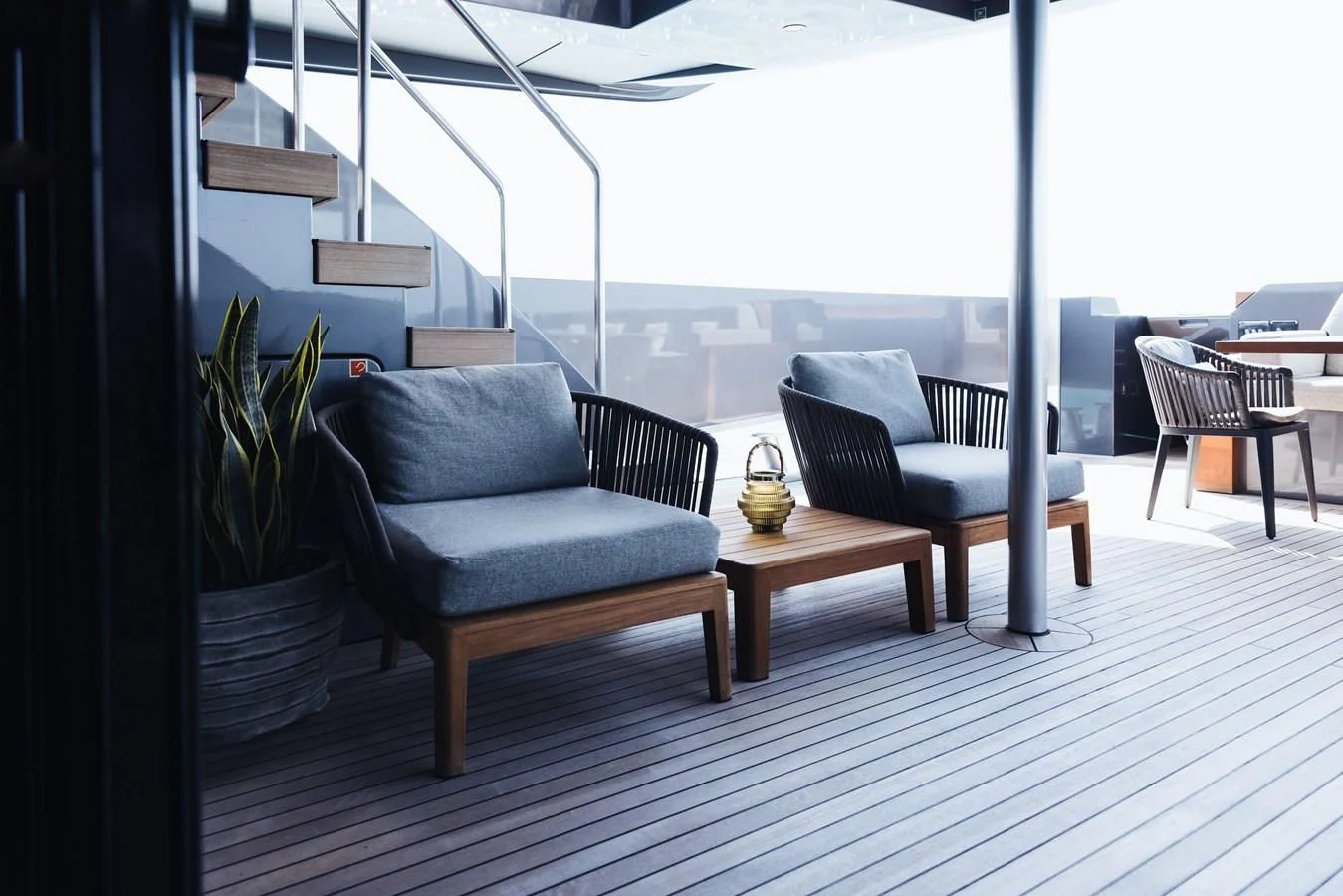 a room with a table and chairs aboard SIMPLY EIGHT Yacht for Sale