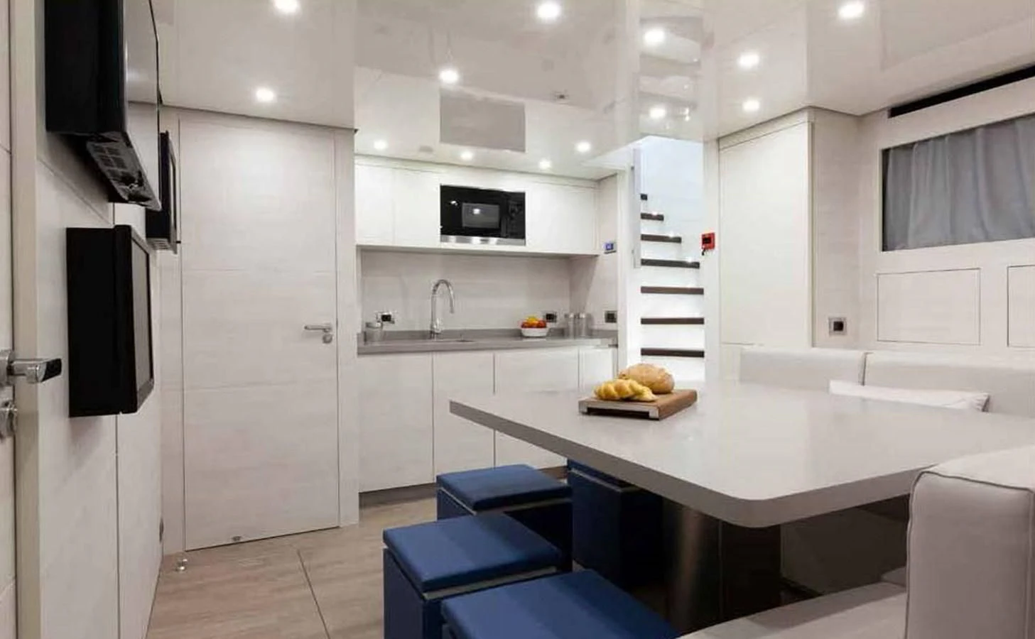 a kitchen with a table and chairs aboard SIMPLY EIGHT Yacht for Sale