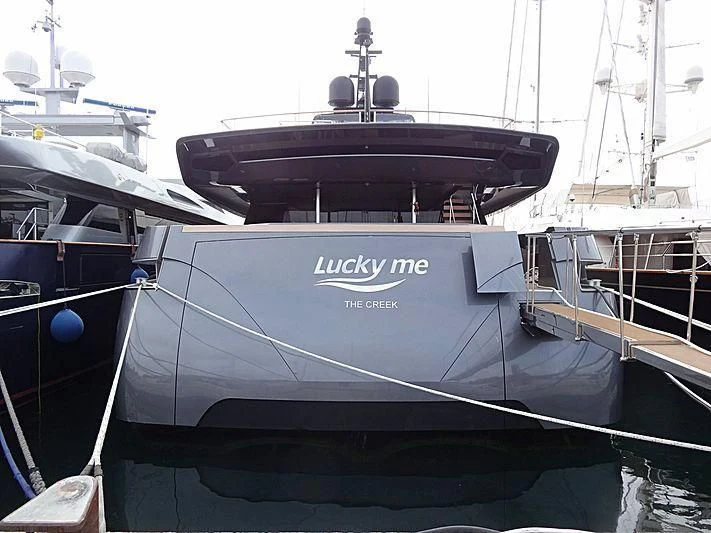 a black boat on a dock aboard SIMPLY EIGHT Yacht for Sale