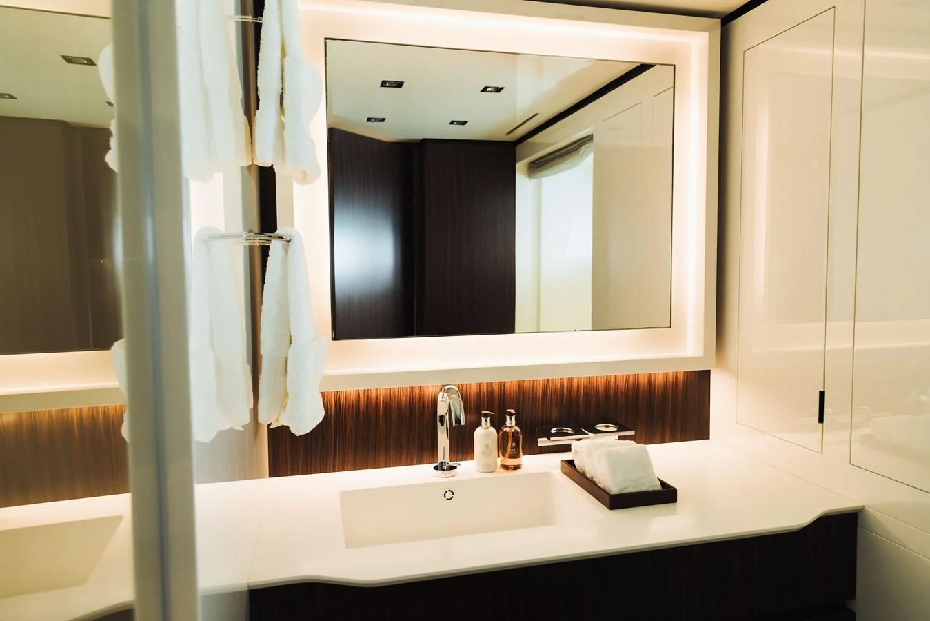 a bathroom with a large mirror aboard SIMPLY EIGHT Yacht for Sale