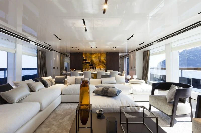 a living room with a glass of beer and a couch aboard SIMPLY EIGHT Yacht for Sale