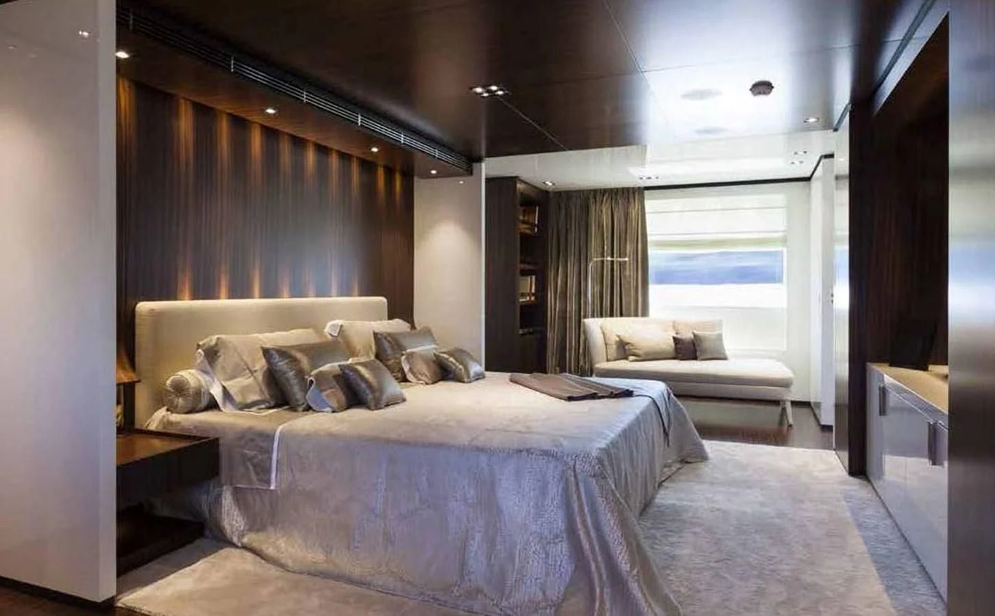 a room with a bed and a couch aboard SIMPLY EIGHT Yacht for Sale