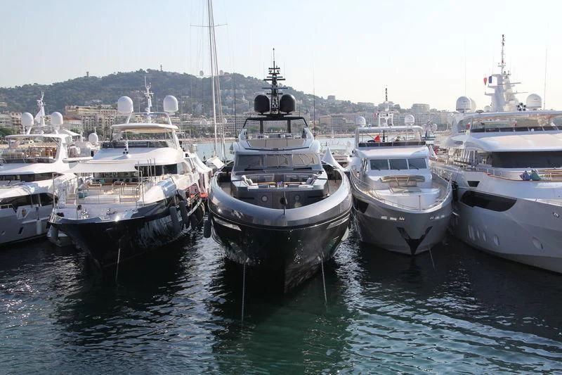 a group of boats are parked in a harbor aboard SIMPLY EIGHT Yacht for Sale