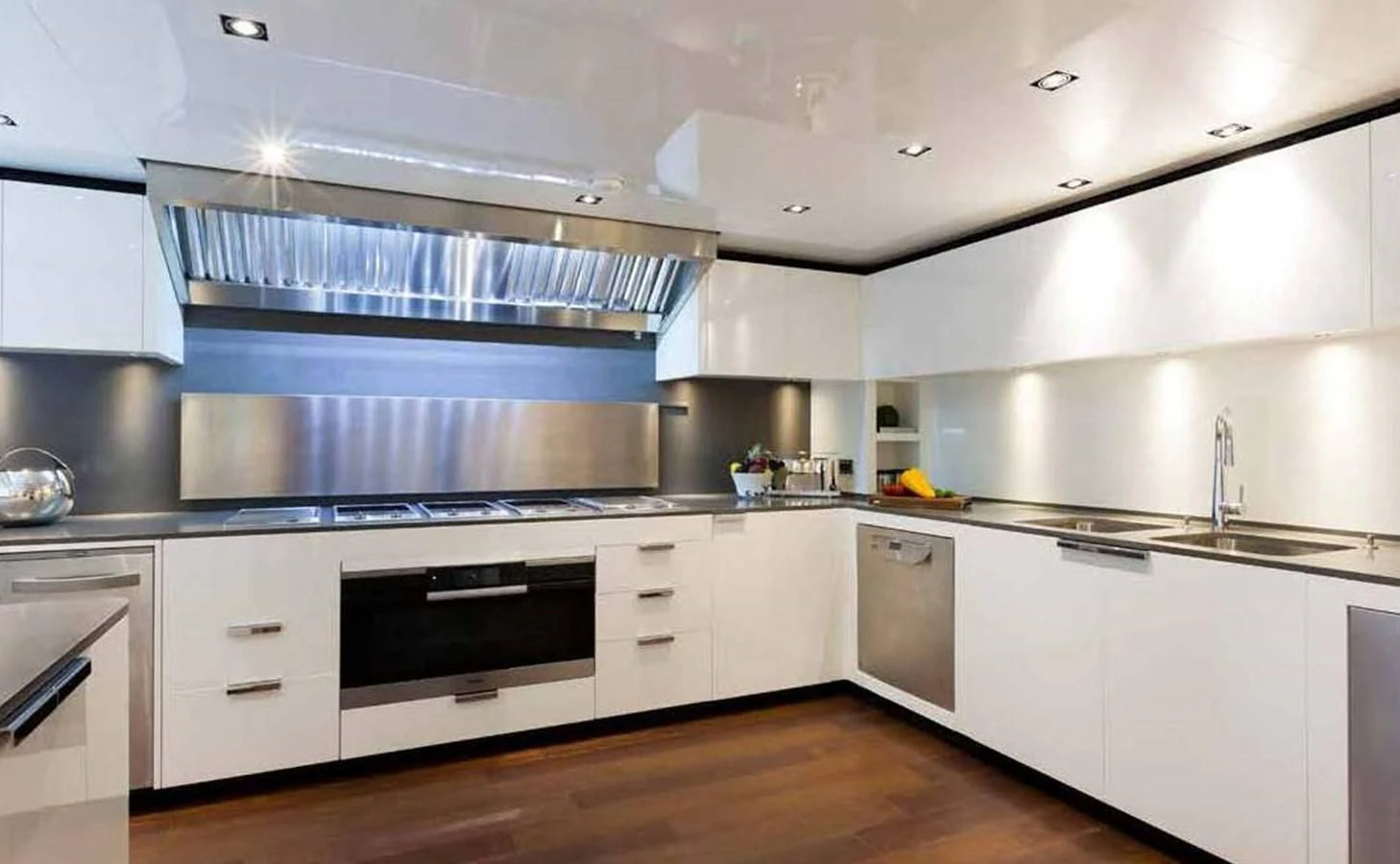 a kitchen with white cabinets aboard SIMPLY EIGHT Yacht for Sale