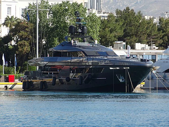 a large boat is parked in a harbor aboard SIMPLY EIGHT Yacht for Sale