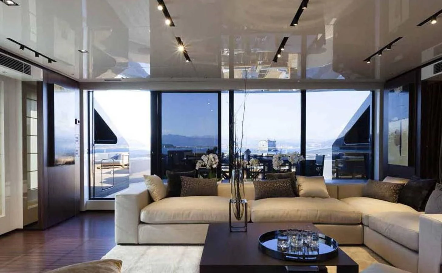 a living room with a large window aboard SIMPLY EIGHT Yacht for Sale
