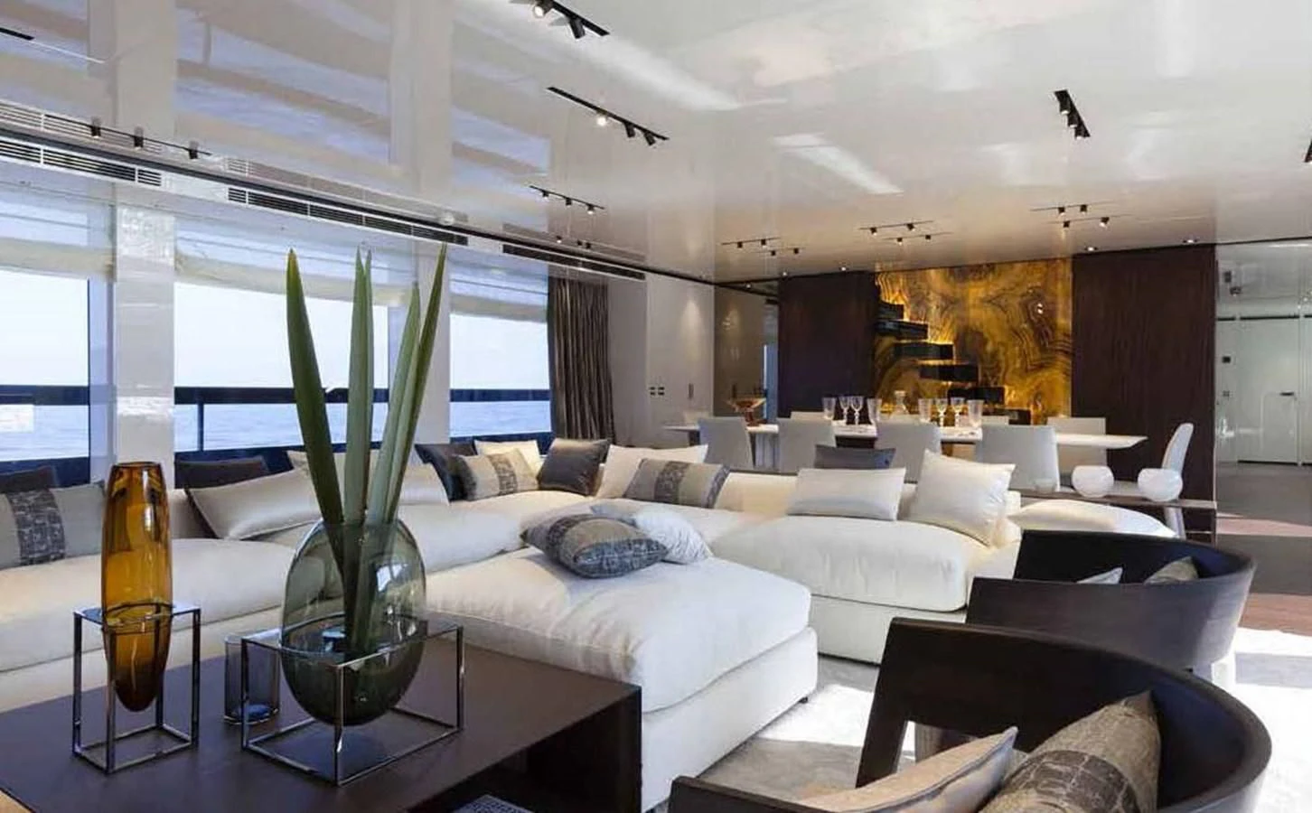 a living room with a large glass vase with a plant in it aboard SIMPLY EIGHT Yacht for Sale
