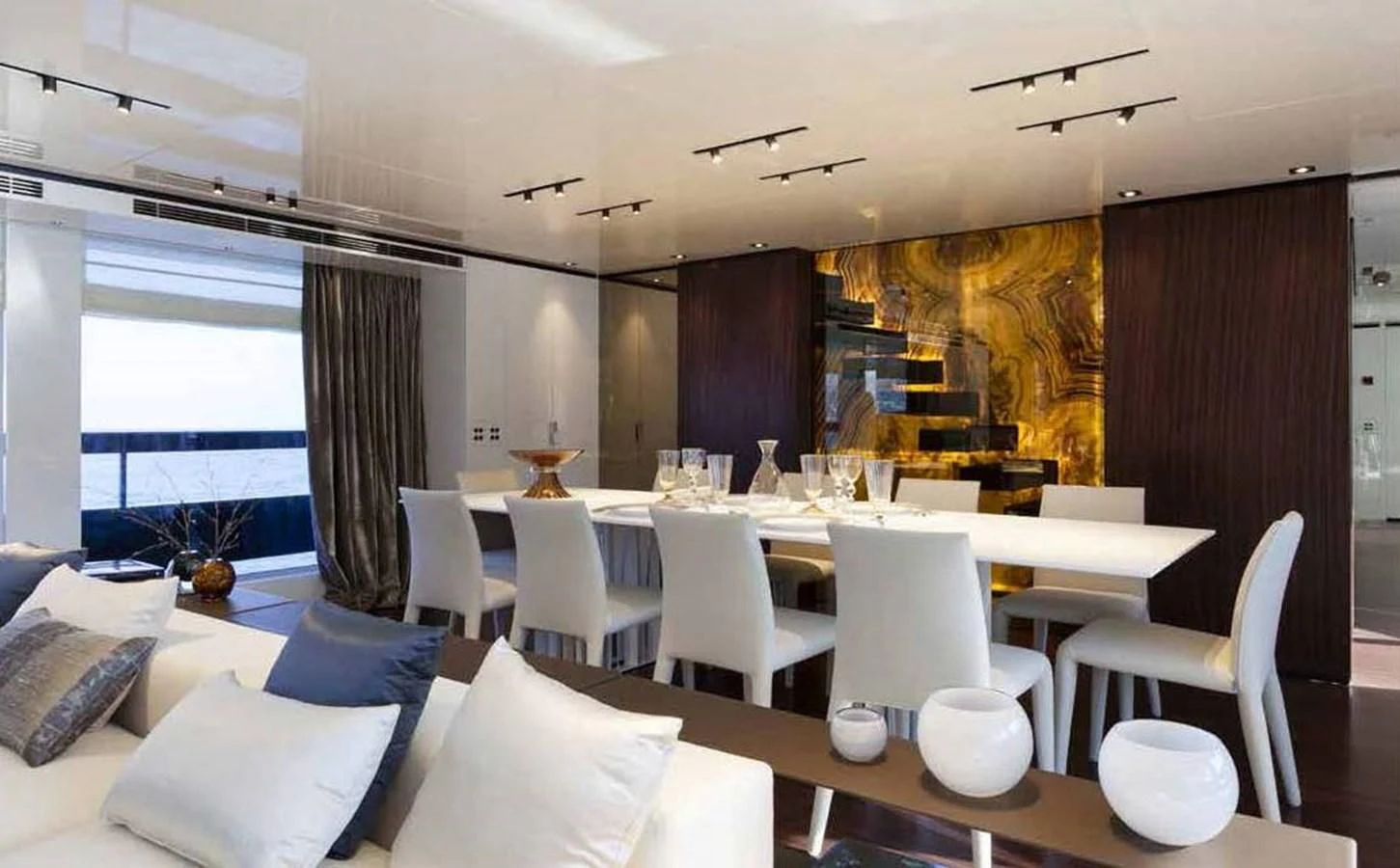 a room with a table chairs and a window aboard SIMPLY EIGHT Yacht for Sale