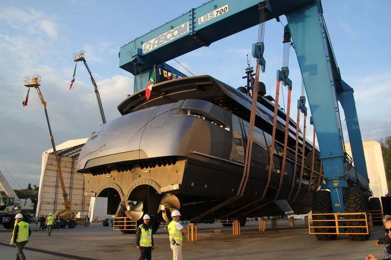 a large ship being loaded aboard SIMPLY EIGHT Yacht for Sale