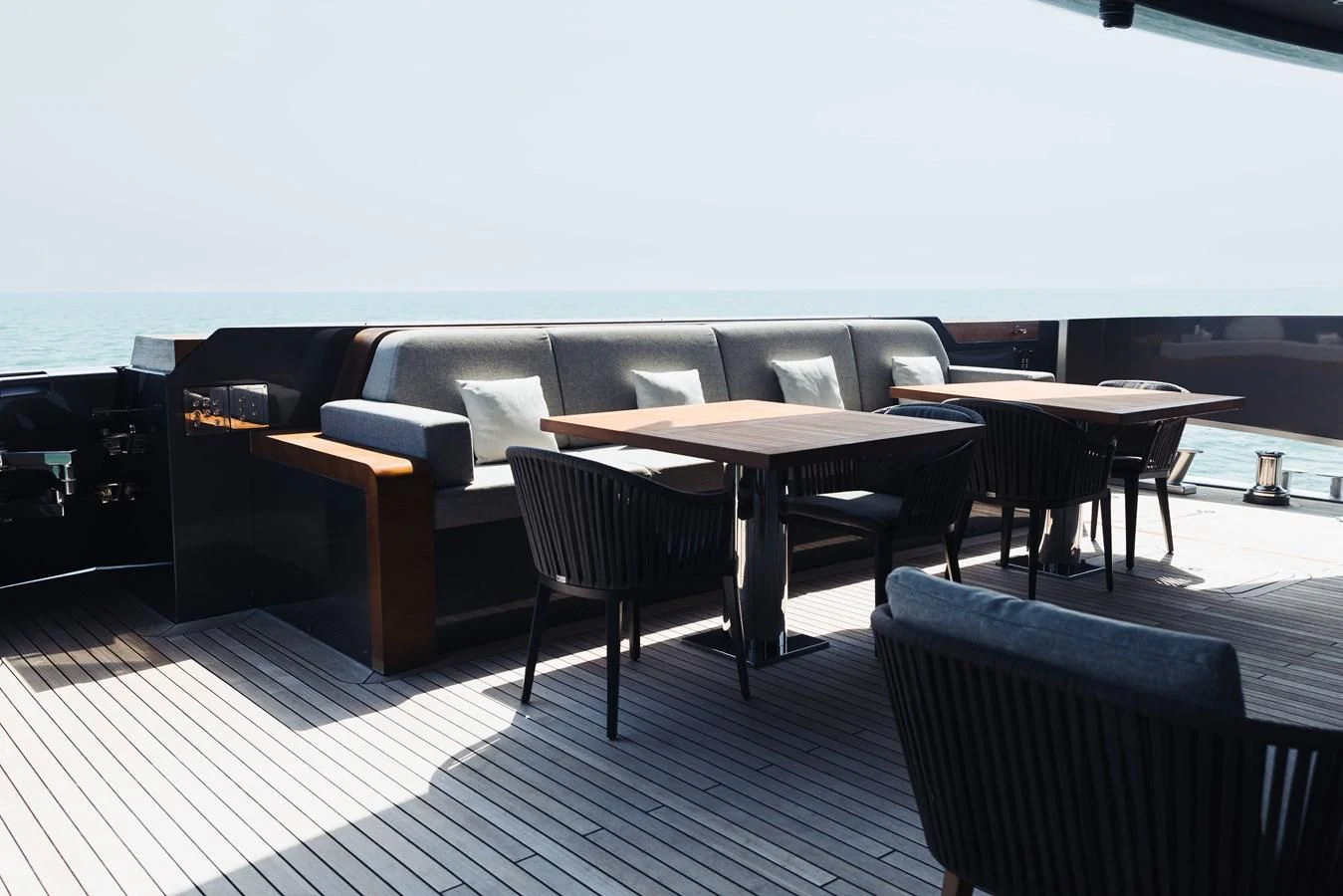 a room with a couch and a table and chairs aboard SIMPLY EIGHT Yacht for Sale