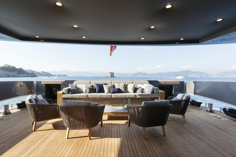 a large room with a large couch and a large body of water aboard SIMPLY EIGHT Yacht for Sale