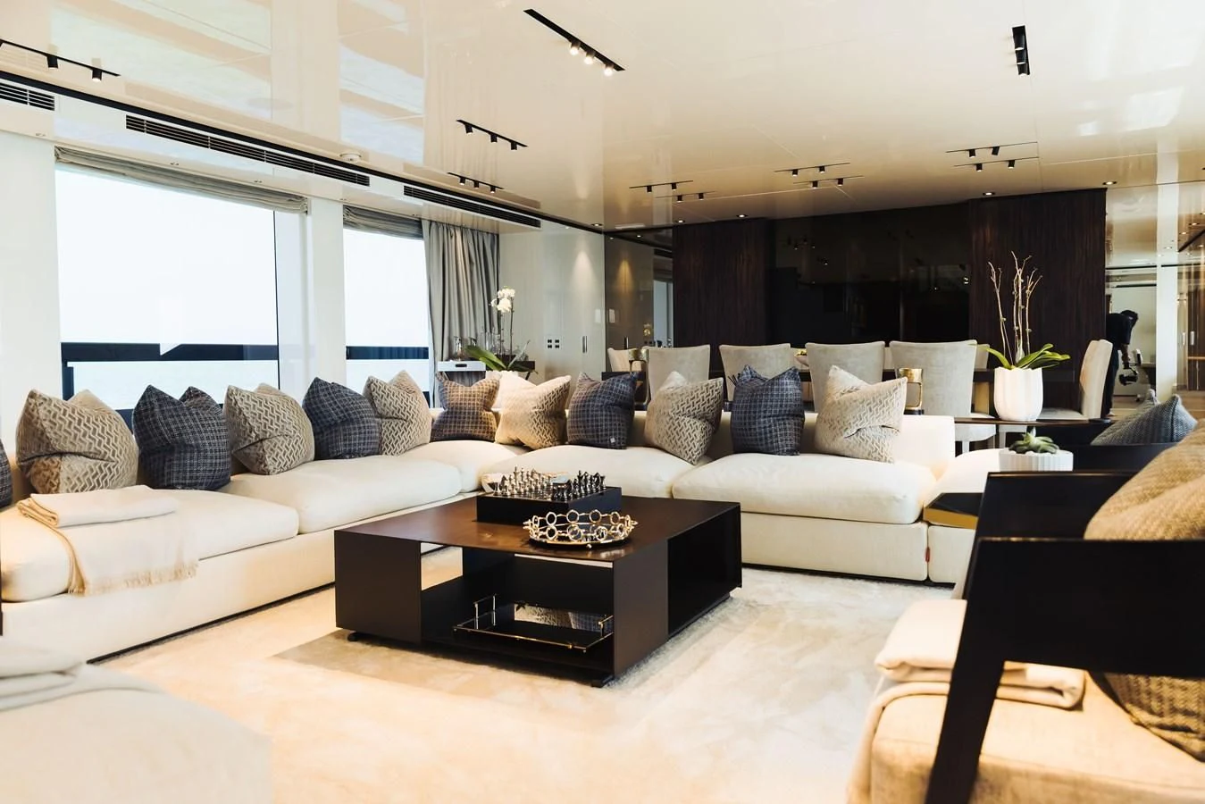 a living room with a white couch and a coffee table aboard SIMPLY EIGHT Yacht for Sale