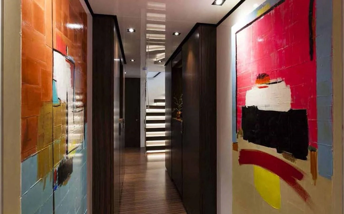 a hallway with a red wall and a white towel from the ceiling aboard SIMPLY EIGHT Yacht for Sale