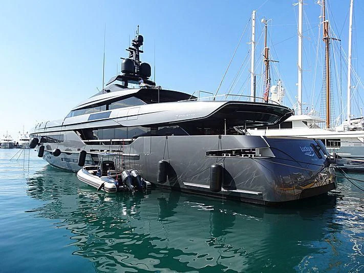 a large boat is parked in the water aboard SIMPLY EIGHT Yacht for Sale