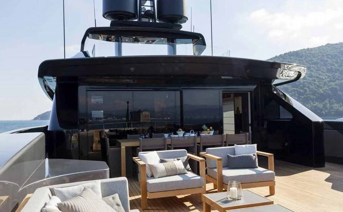 a room with a large black fireplace aboard SIMPLY EIGHT Yacht for Sale