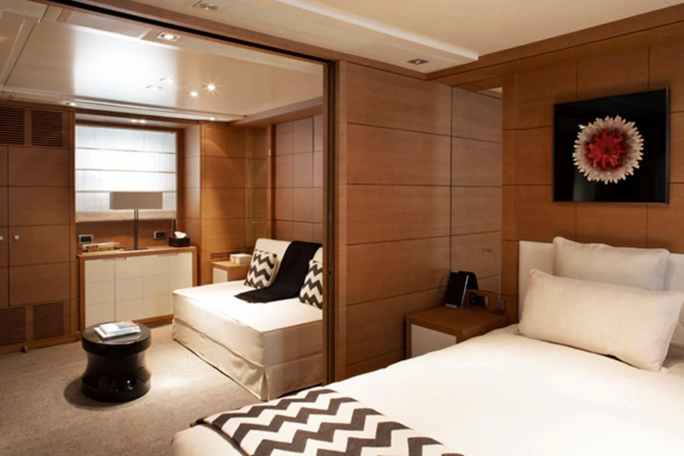 a room with a bed and a desk aboard MINA Yacht for Sale