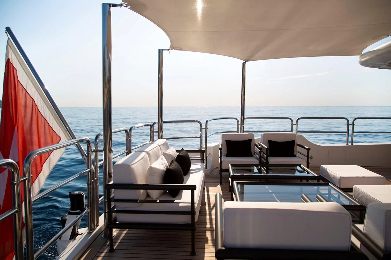 a boat with a table and chairs on it aboard MINA Yacht for Sale