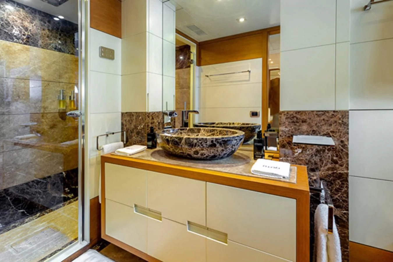 a bathroom with a sink and a mirror aboard MINA Yacht for Sale