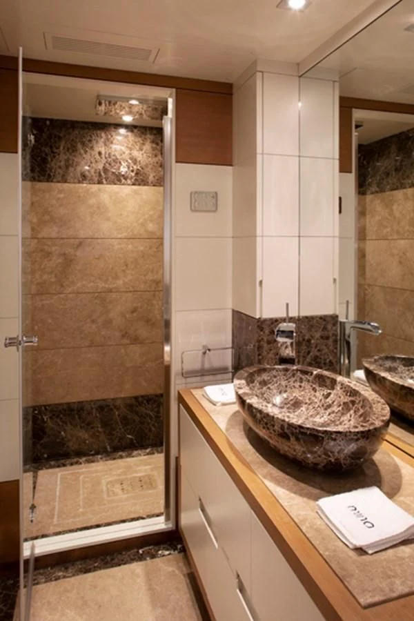 a bathroom with a marble counter top aboard MINA Yacht for Sale