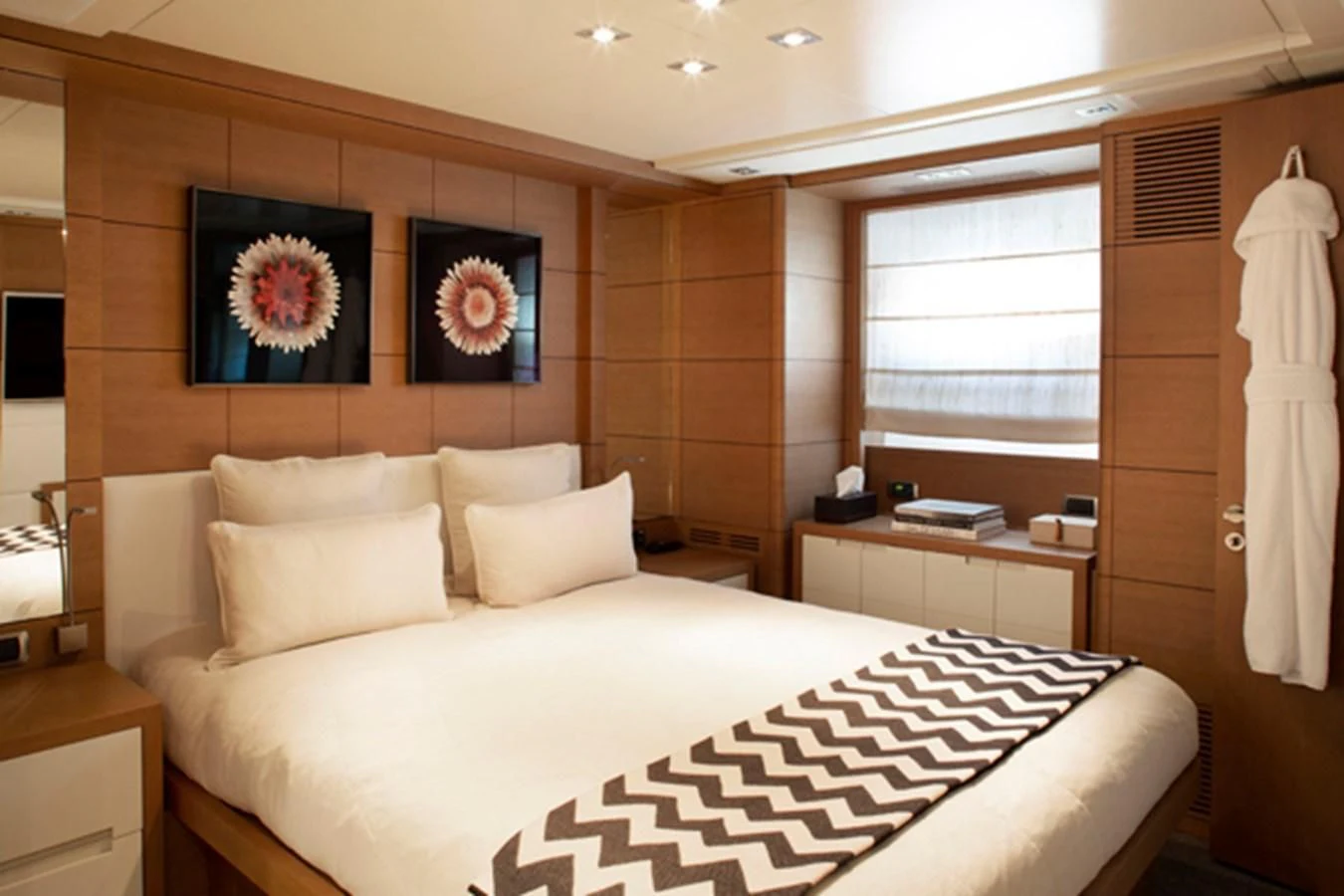 a bed with white sheets aboard MINA Yacht for Sale