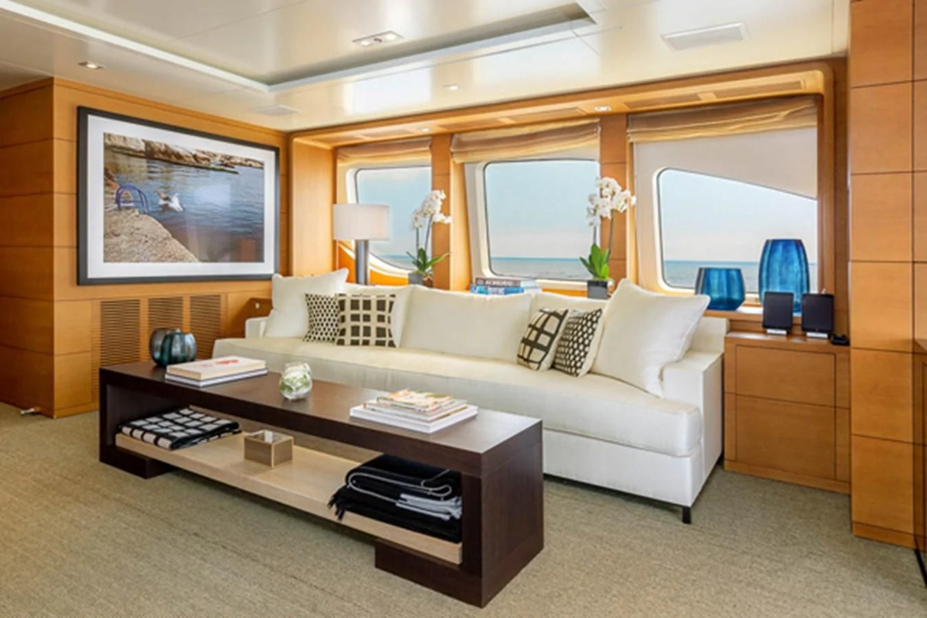 a living room with a couch and a coffee table aboard MINA Yacht for Sale