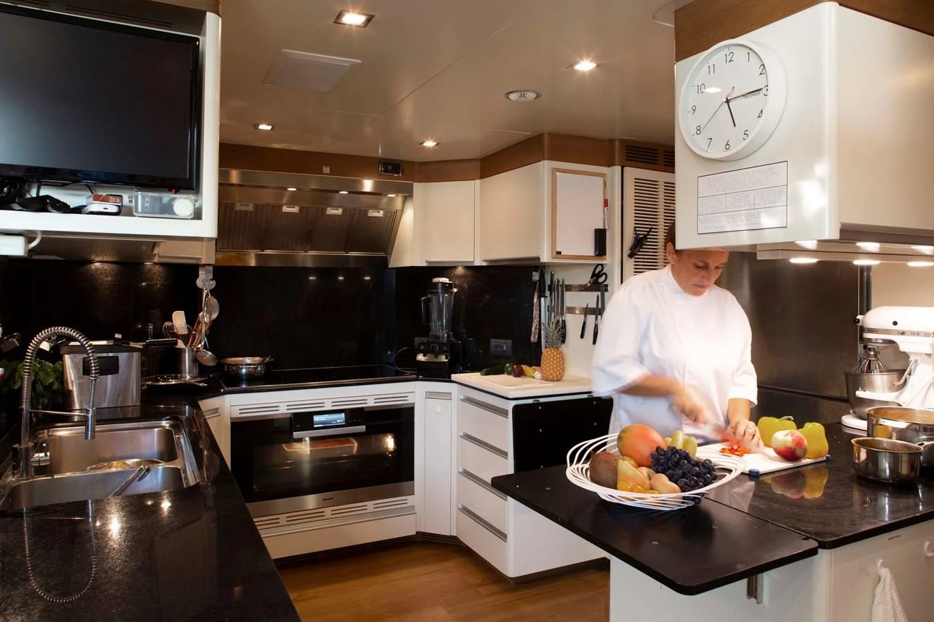 a chef in a kitchen aboard MINA Yacht for Sale