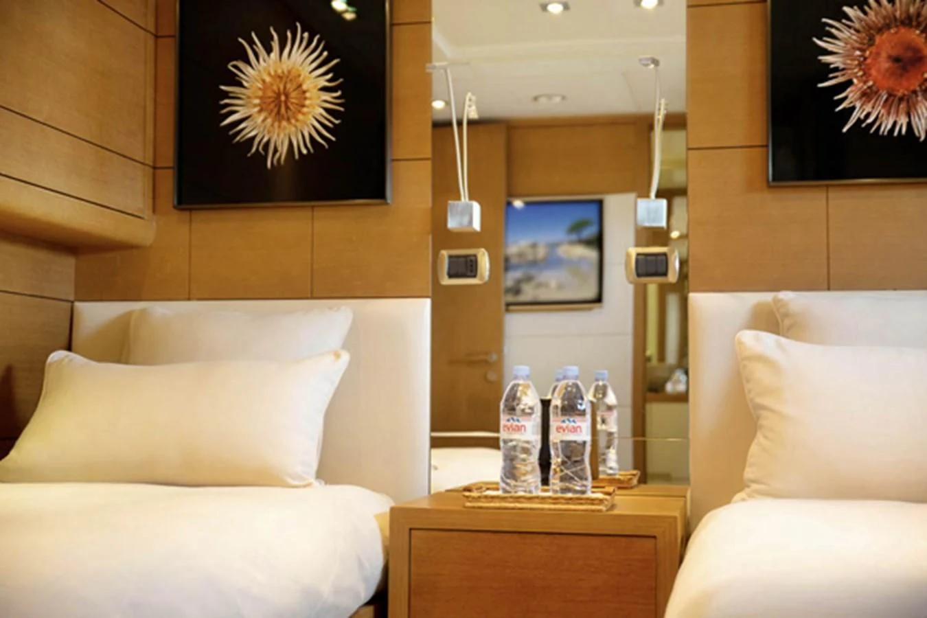 a room with a table and a couch and a lamp aboard MINA Yacht for Sale