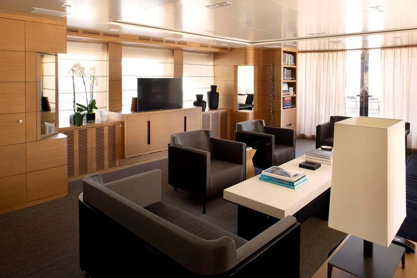 a room with a couch and a table aboard MINA Yacht for Sale