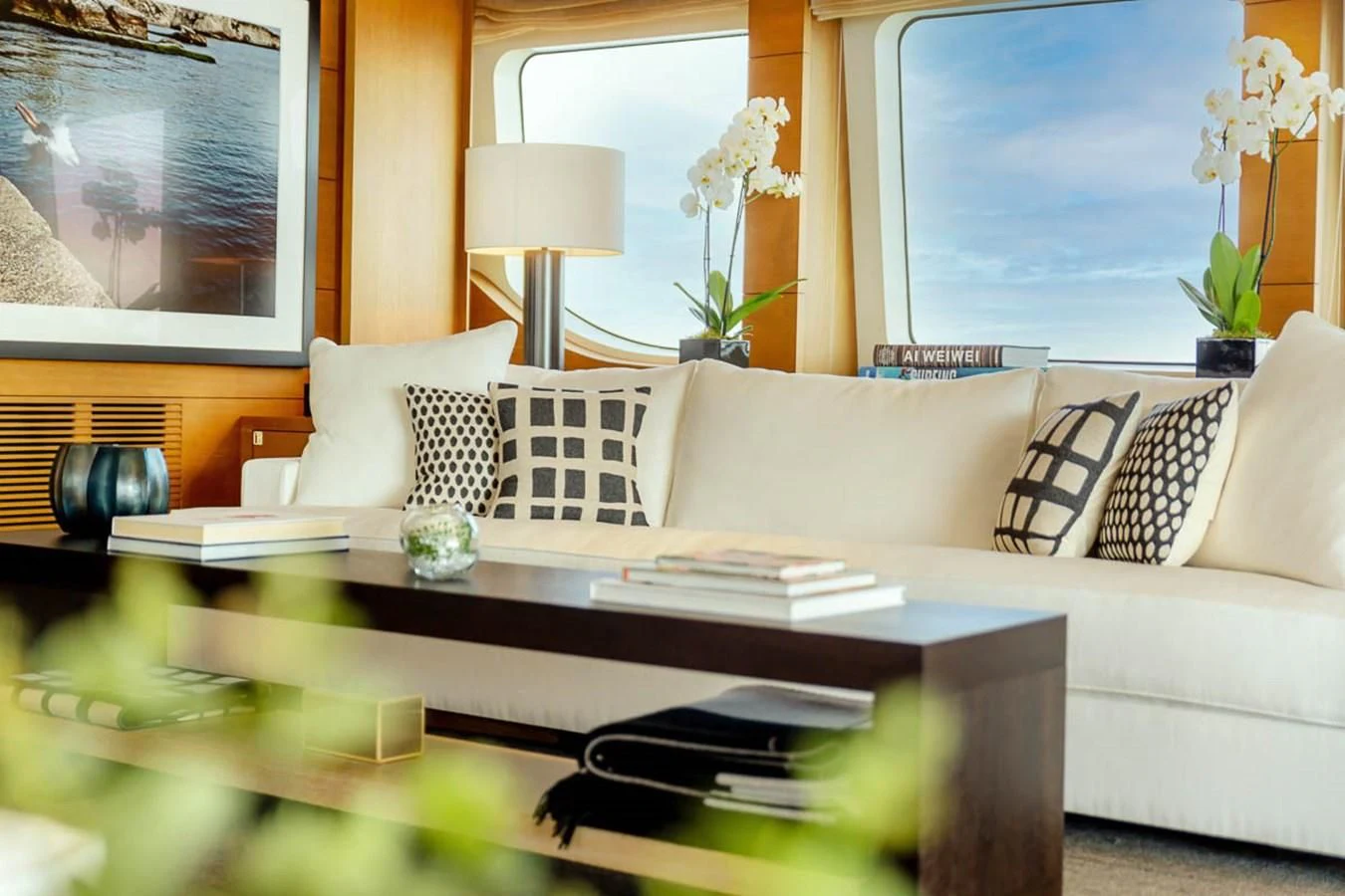 a living room with a white couch and a coffee table aboard MINA Yacht for Sale