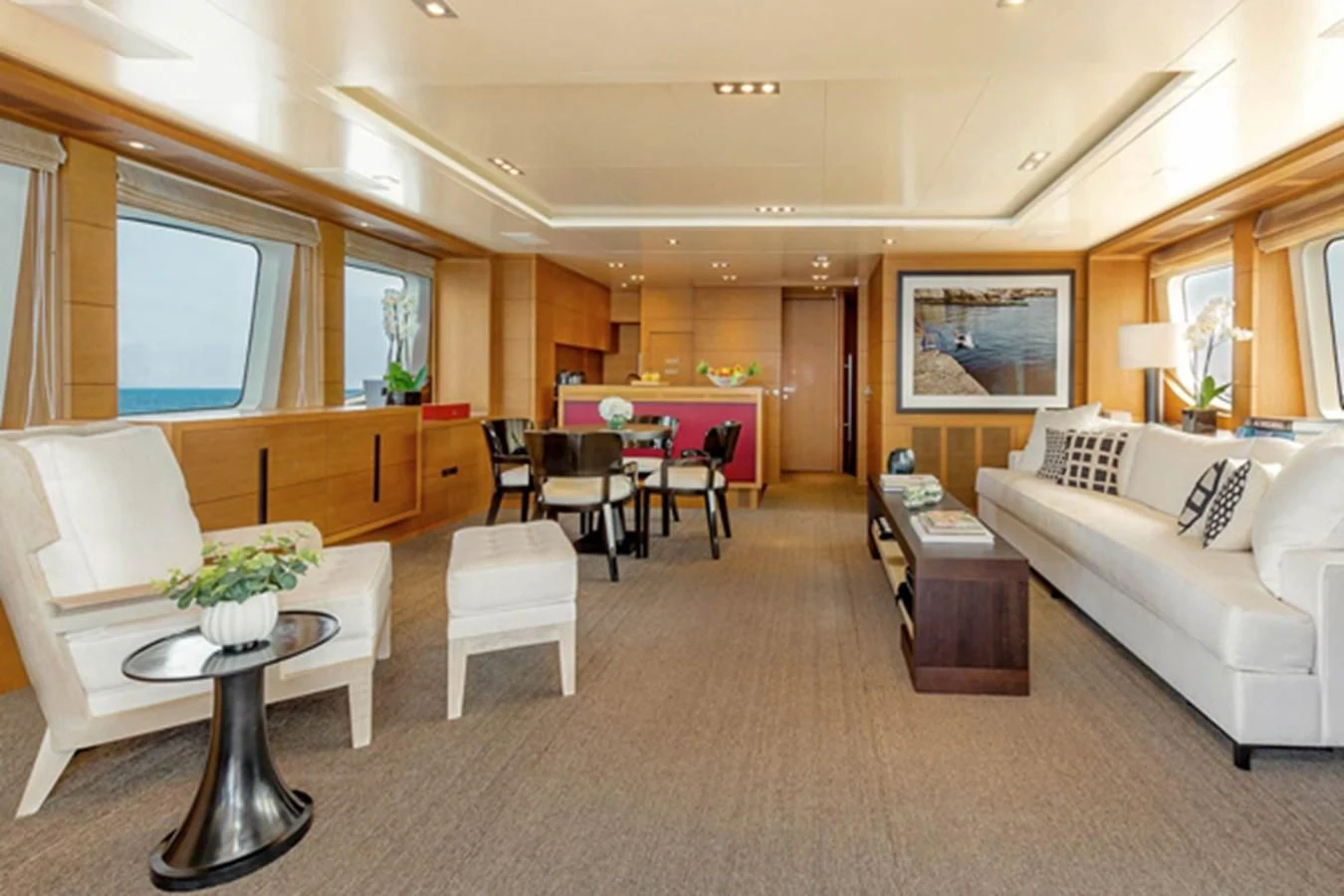 a living room with a couch and a table aboard MINA Yacht for Sale