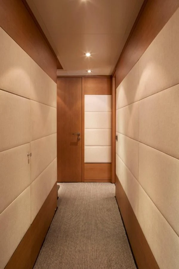 a hallway with a door and a mirror aboard MINA Yacht for Sale