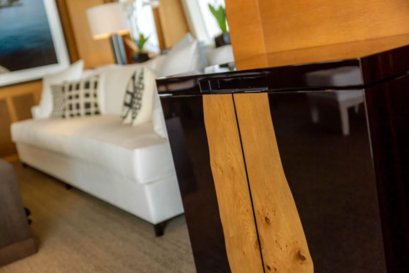 a living room with a white couch aboard MINA Yacht for Sale