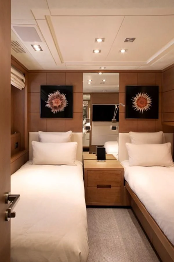 a room with a bed and a tv aboard MINA Yacht for Sale