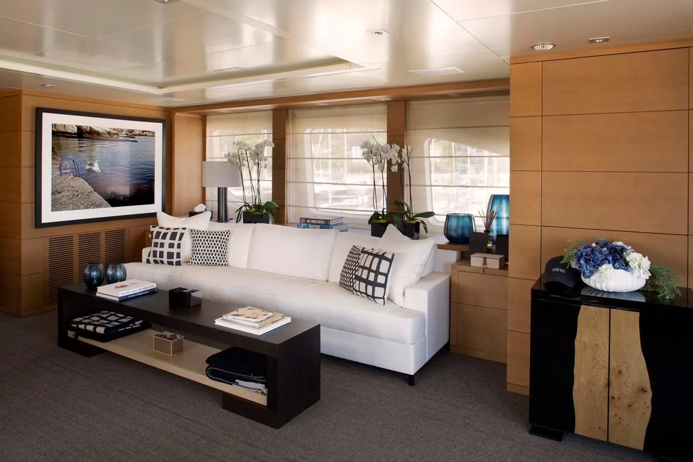 a living room with a white couch aboard MINA Yacht for Sale