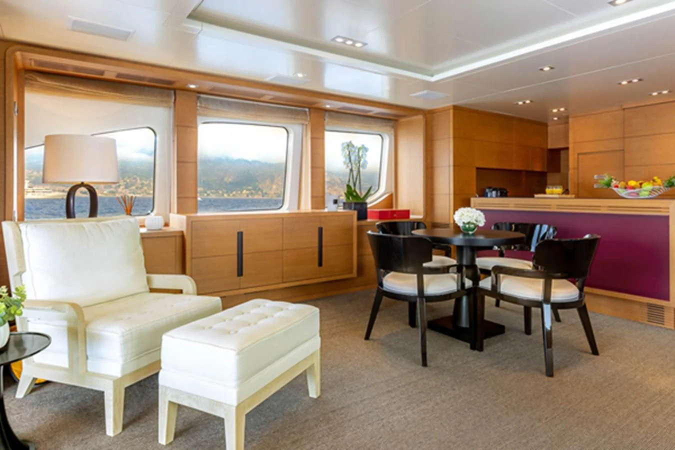 a room with a table and chairs aboard MINA Yacht for Sale