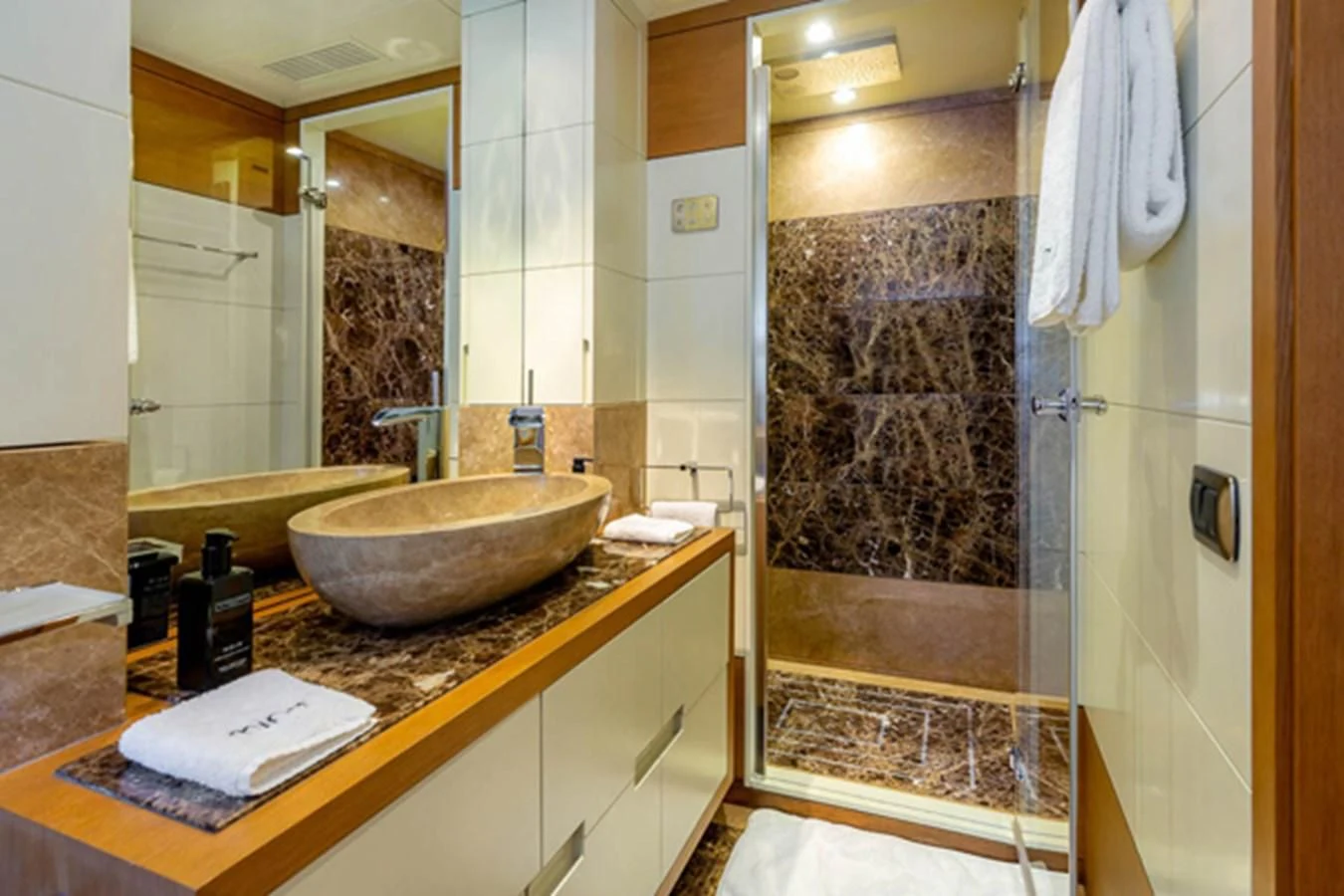 a bathroom with a sink and a mirror aboard MINA Yacht for Sale